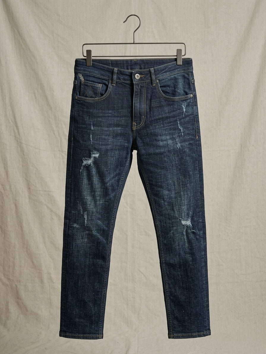 MIDNIGHT INDIGO DISTRESSED SLIM JEANS